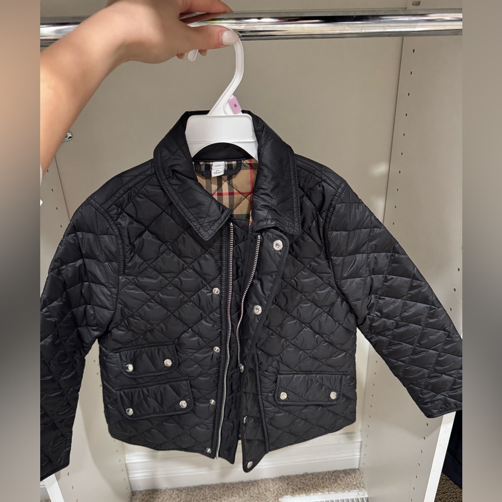 Burberry jacket for boys. Size is 6T and the color or is black and logo.